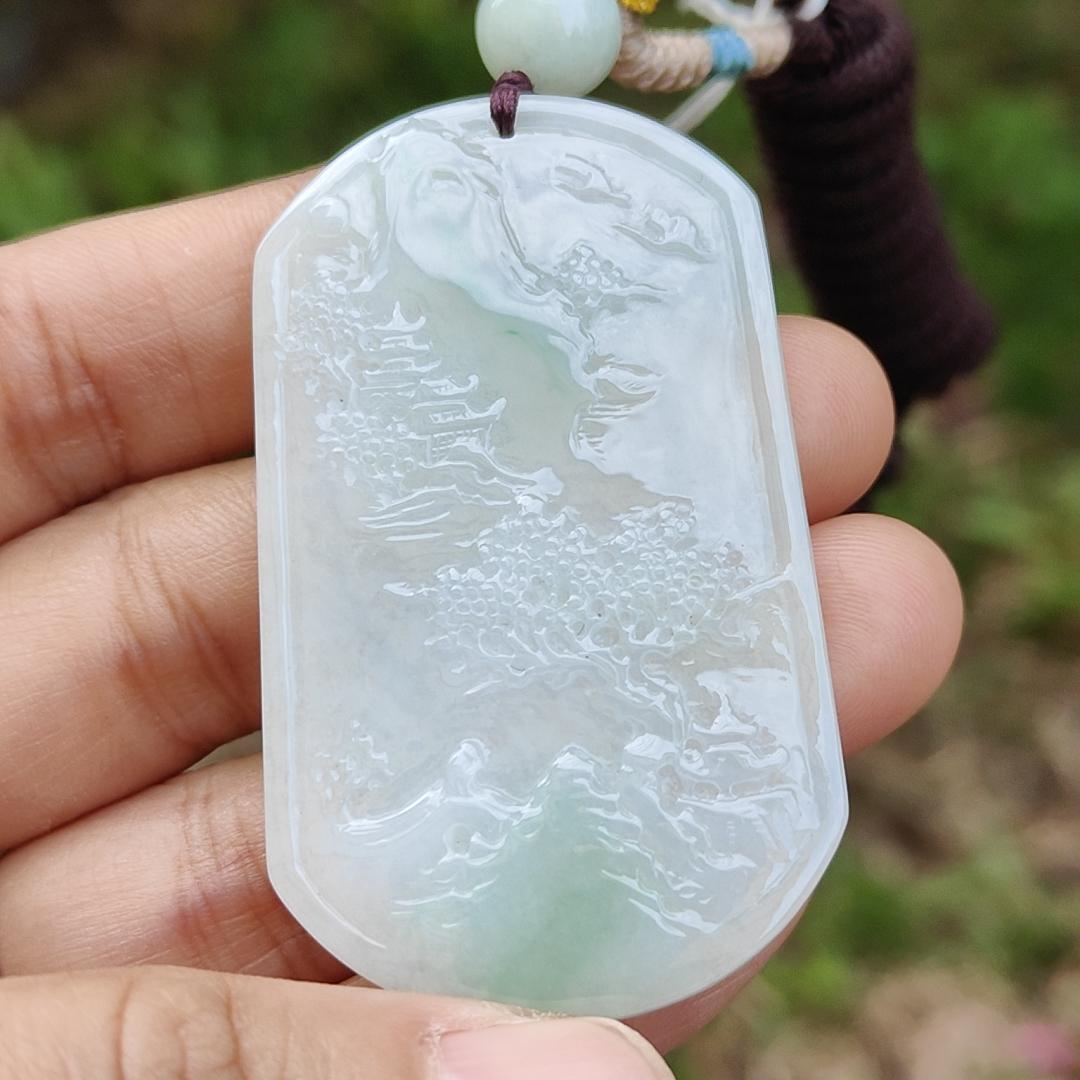 Quality Semi Icy White and Light Green Patches Natural Type A Jadeite Jade crafted with sceneries as pendant with QIC labs approved certificate weigh 24.89 grams, measurement 54 * 32 * 4.5 mm (pendant227)