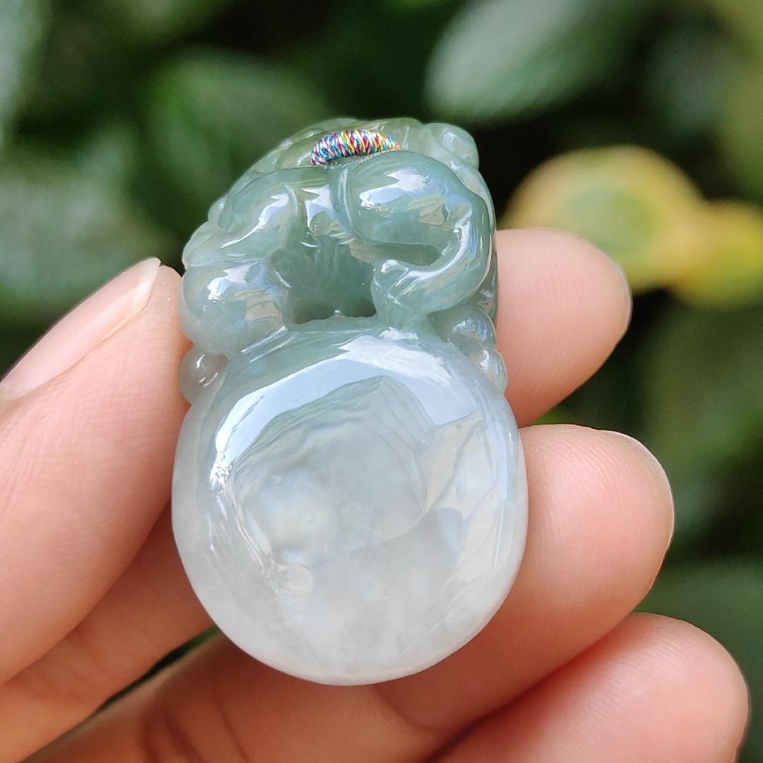 Light Green Natural Type A Jadeite Jade crafted with Lion as Pendant certificate weighs 14.94 grams, measurement 36.6 * 20.5 * 10.8 mm (pendant249)