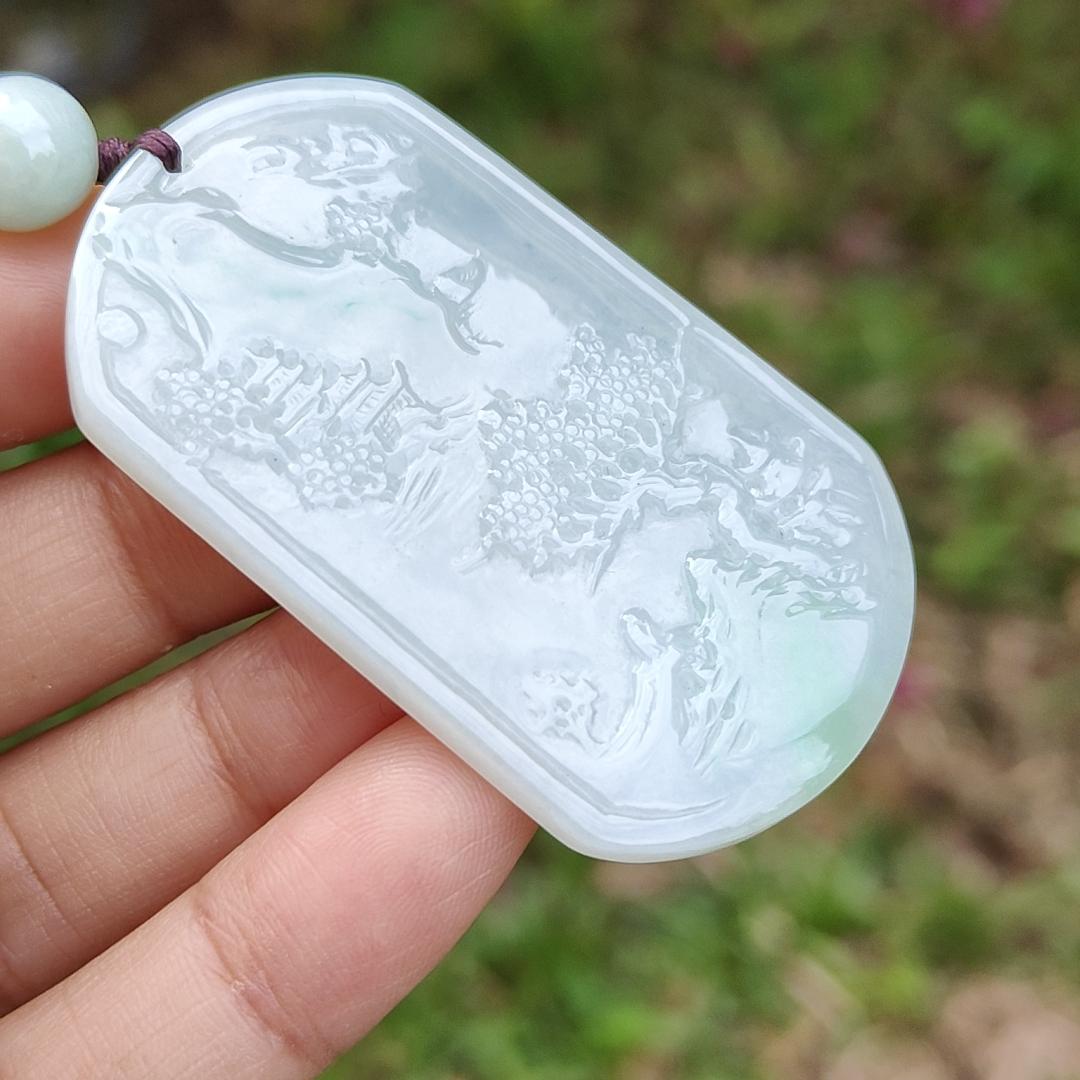 Quality Semi Icy White and Light Green Patches Natural Type A Jadeite Jade crafted with sceneries as pendant with QIC labs approved certificate weigh 24.89 grams, measurement 54 * 32 * 4.5 mm (pendant227)