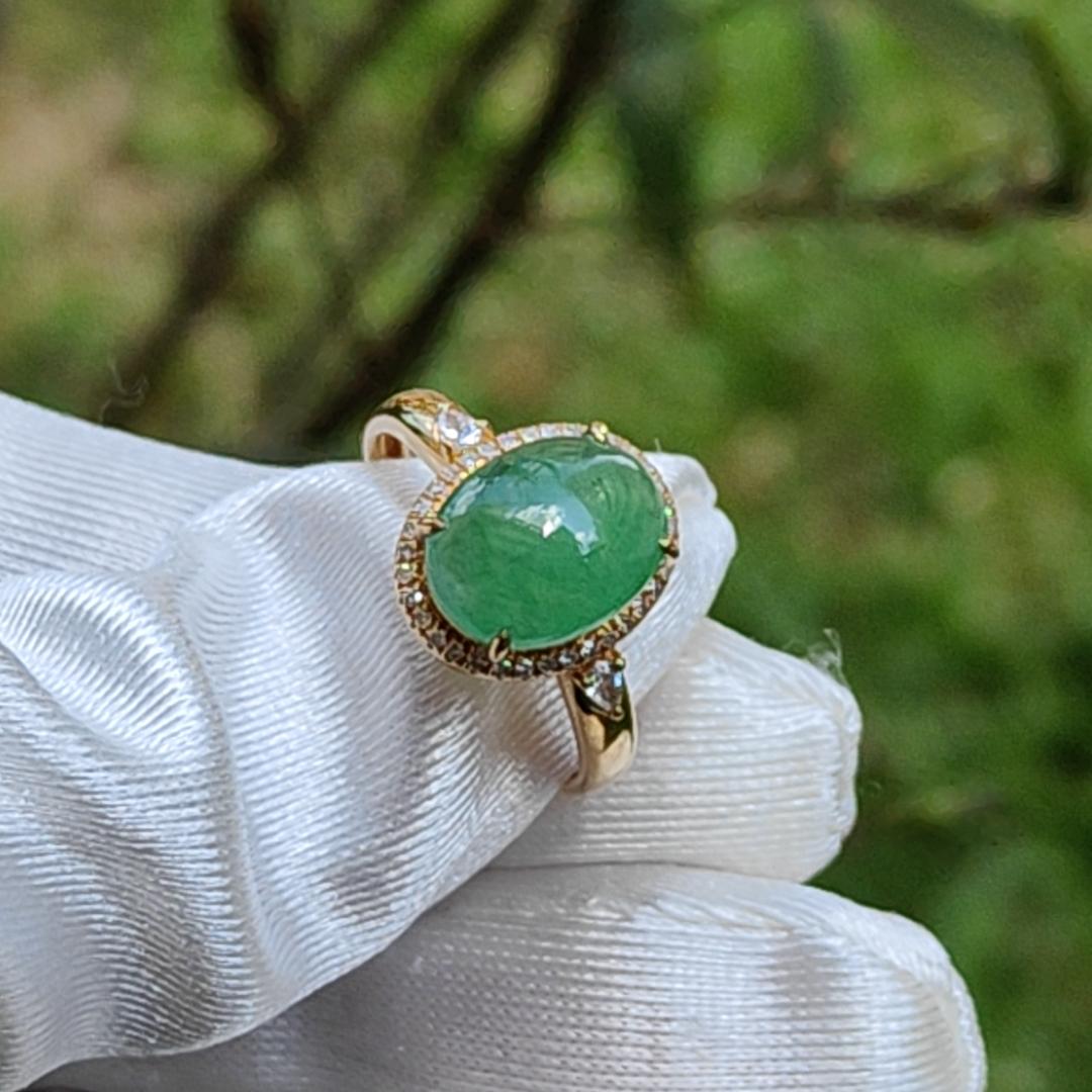 18K Gold weigh 2 grams, Setting with Natural Type A Jadeite Green Cabochon size 10.7 * 8.3 * 3.8 mm with 35 * 0.003 and 2 * 0.03 pear cut diamonds, certificate included weigh 2.65 grams, Finger ring size 17.3 mm,