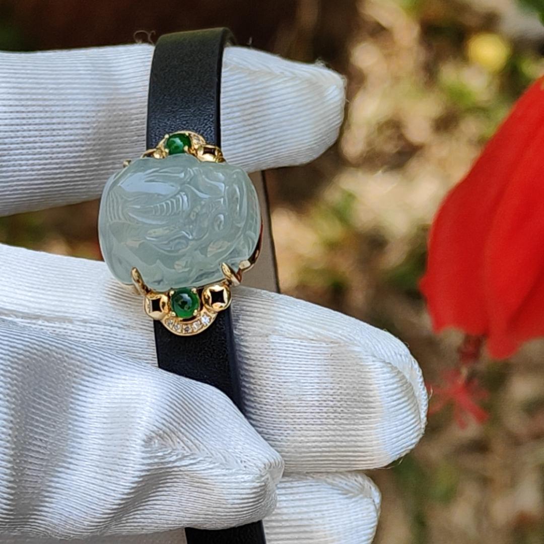 Light Green Hue Natural Type A Jadeite Jade crafted as Pixiu set on 18k Gold with 2 Green Cabochon and diamonds, adding PU wrist band upgraded elegant style bracelet, certificate weigh 4.44 grams, measurement 16.6 * 14.1 * 7.5 mm (18kpw1)