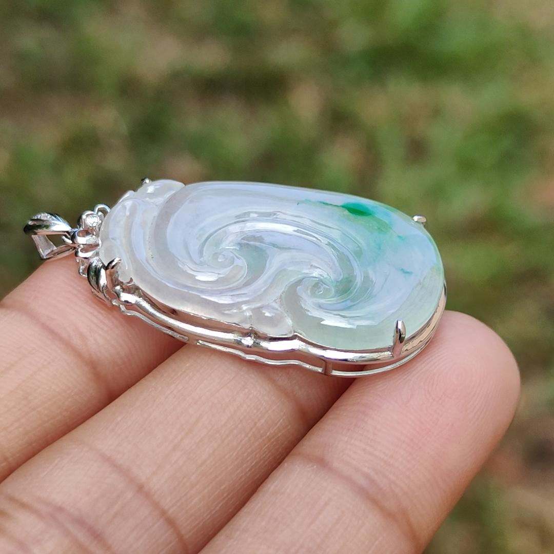 Icy Translucent with Light Green Patches Natural Type A Jadeite Jade crafted with shape of Ruyi set on 18k Gold as Pendant, certificate weighs 4.01 grams, measurement 37.6 * 18 * 5.5 mm (18kp51)