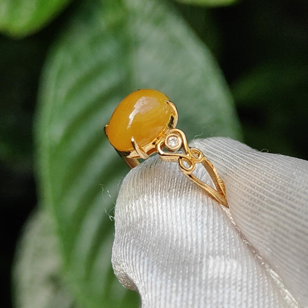 Yellow with a bit reddish Natural Type A Jadeite Jade Cabochon 8.6 * 7 * 3.6 mm set on 18k Gold as Ring adding 2 diamonds with certificate weigh 2.08 grams, finger size 16.8 mm (18kring13)