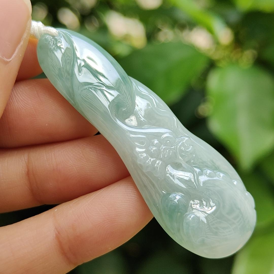 Good Quality Beautiful Natural Type A Jadeite Jade Light Green with Green Hue crafted with Dragon as Pendant, QIC labs approved certificated weigh 15.74 grams, measurements 56 * 20.5 * 6.2 mm (pendant296)