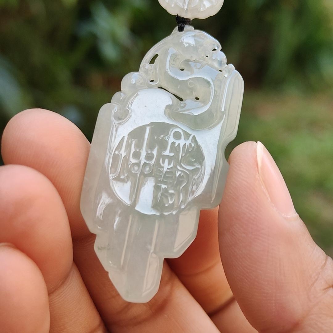 Icy Translucent Natural Type A Jadeite Jade beautifully crafted with old school dragon as pendant, certificate weighs 14.63 grams (pendant246)