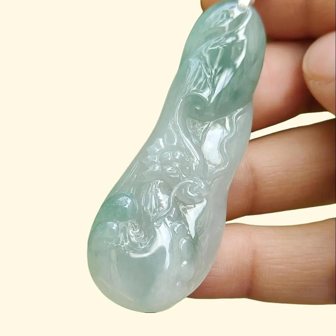 Good Quality Beautiful Natural Type A Jadeite Jade Light Green with Green Hue crafted with Dragon as Pendant, QIC labs approved certificated weigh 15.74 grams, measurements 56 * 20.5 * 6.2 mm (pendant296)