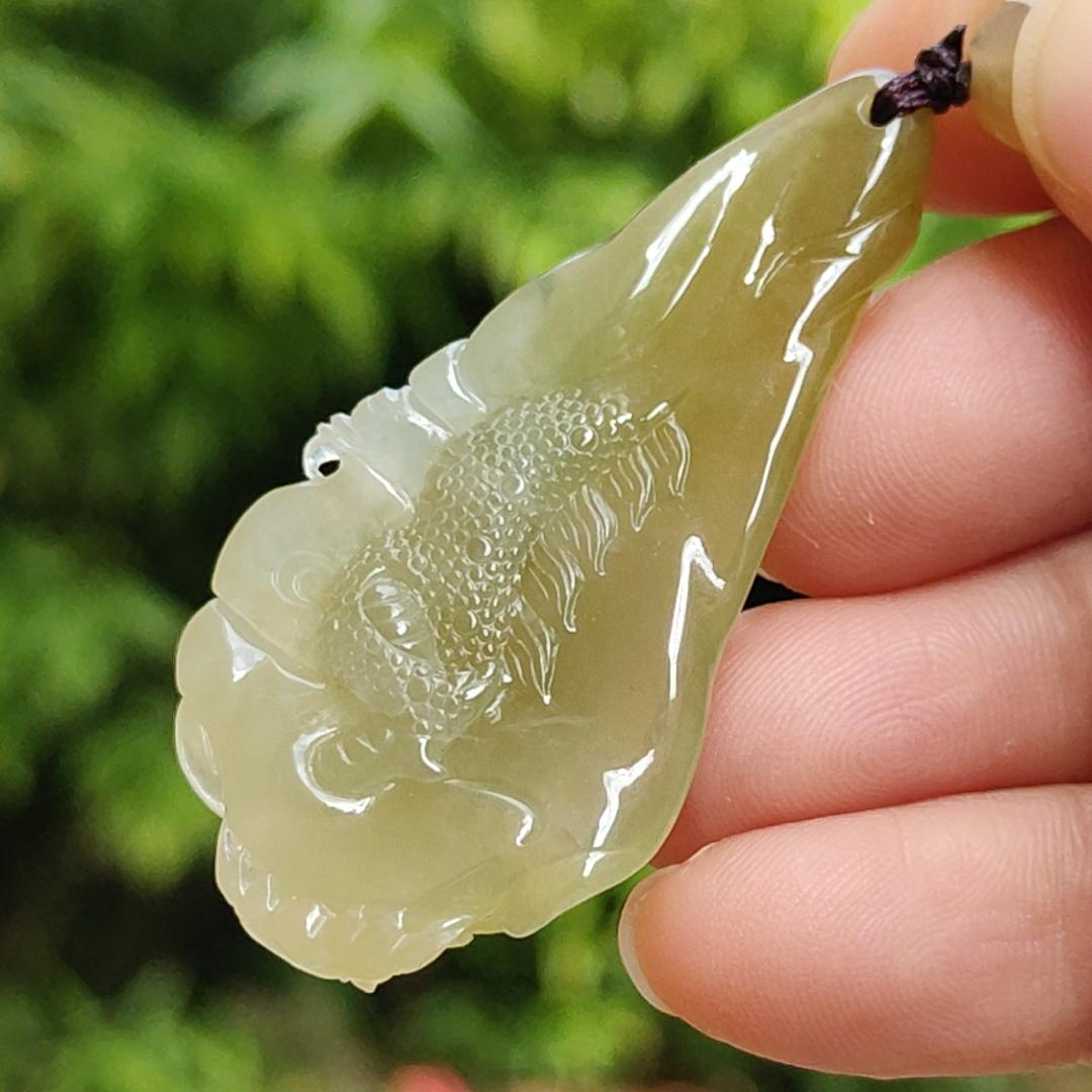 Premium Icy Yellow Natural Type A Jadeite Jade crafted with Dragon as Pendant certificate weighs 15.64 grams, measurement 50.6 * 27 * 11.5 mm (pendant253)