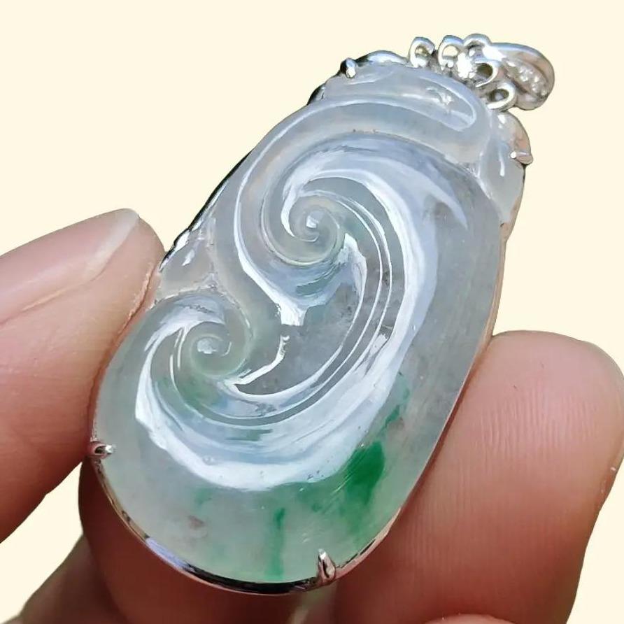 Icy Translucent with Light Green Patches Natural Type A Jadeite Jade crafted with shape of Ruyi set on 18k Gold as Pendant, certificate weighs 4.01 grams, measurement 37.6 * 18 * 5.5 mm (18kp51)