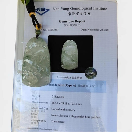 Natural Old Mine Type A Jadeite Pendent Carved with scenery with NGI Gemstone report weighs 285.62 grams 68.51 * 39.18 * 12.33 mm - Good Translucency with 3.34 Specific Gravity - Near Colorless with greenish blue patches pendant (pendant148)