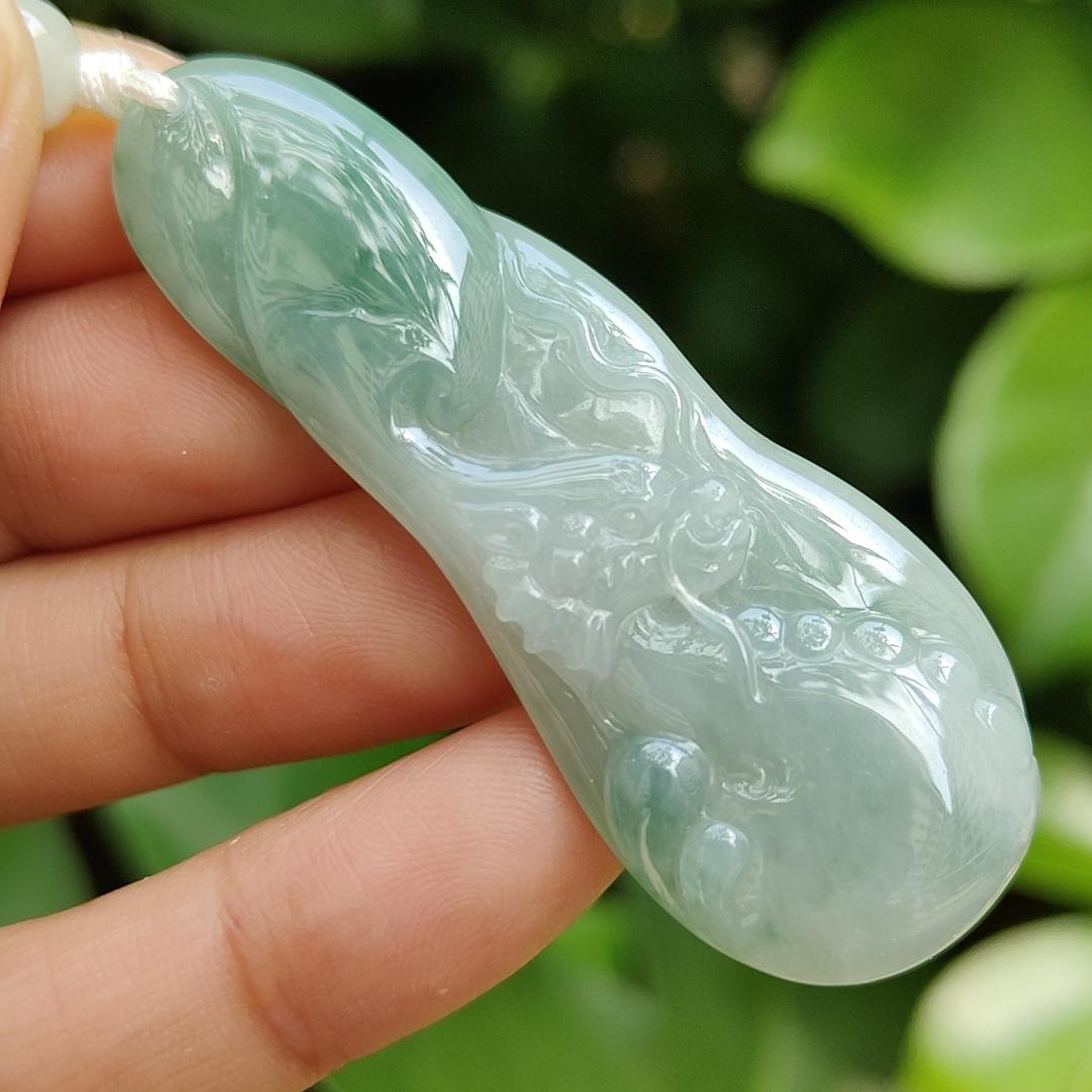 Good Quality Beautiful Natural Type A Jadeite Jade Light Green with Green Hue crafted with Dragon as Pendant, QIC labs approved certificated weigh 15.74 grams, measurements 56 * 20.5 * 6.2 mm (pendant296)