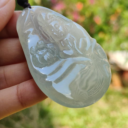 Highly Translucent Icy Variety Colorless to Faint Green Natural Type A Jadeite pendant with NGI Gemstone report weight 166.49 grams , 61.01 * 39.56 * 7.57 mm carved as Guanyin has good translucency with very fine grain crystal aggregate(pendant147)