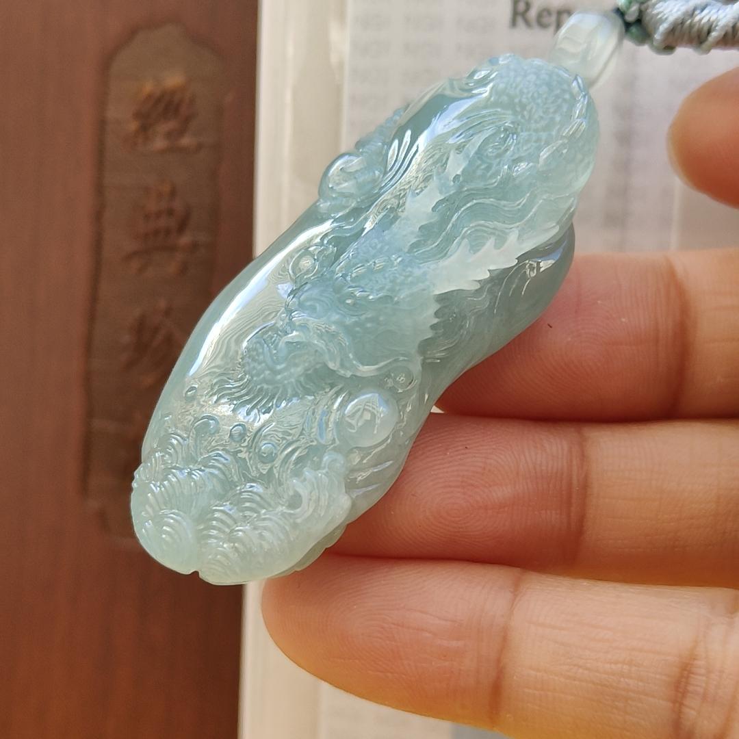 Natural Type A Jadeite Jewellery Pendant carved with dragon weighs at 30.06 grams , 50.32 * 23.30 * 12.93 mm - with Gemstone report from NGI - Very Good Translucency with faint greenish blue (pendant140)