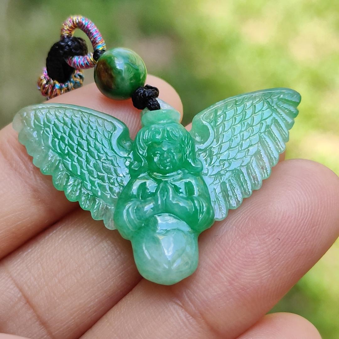 Green Jadeite carved as Angel (Front) and Cross (back) Natural Type A Jadeite pendant with NGI Gemstone report weight 6.33 gram , 35.39 * 23.76 * 5.61 mm with Translucent fine grain crystal aggregate granular and fibrous interlocking texture (pendant139)