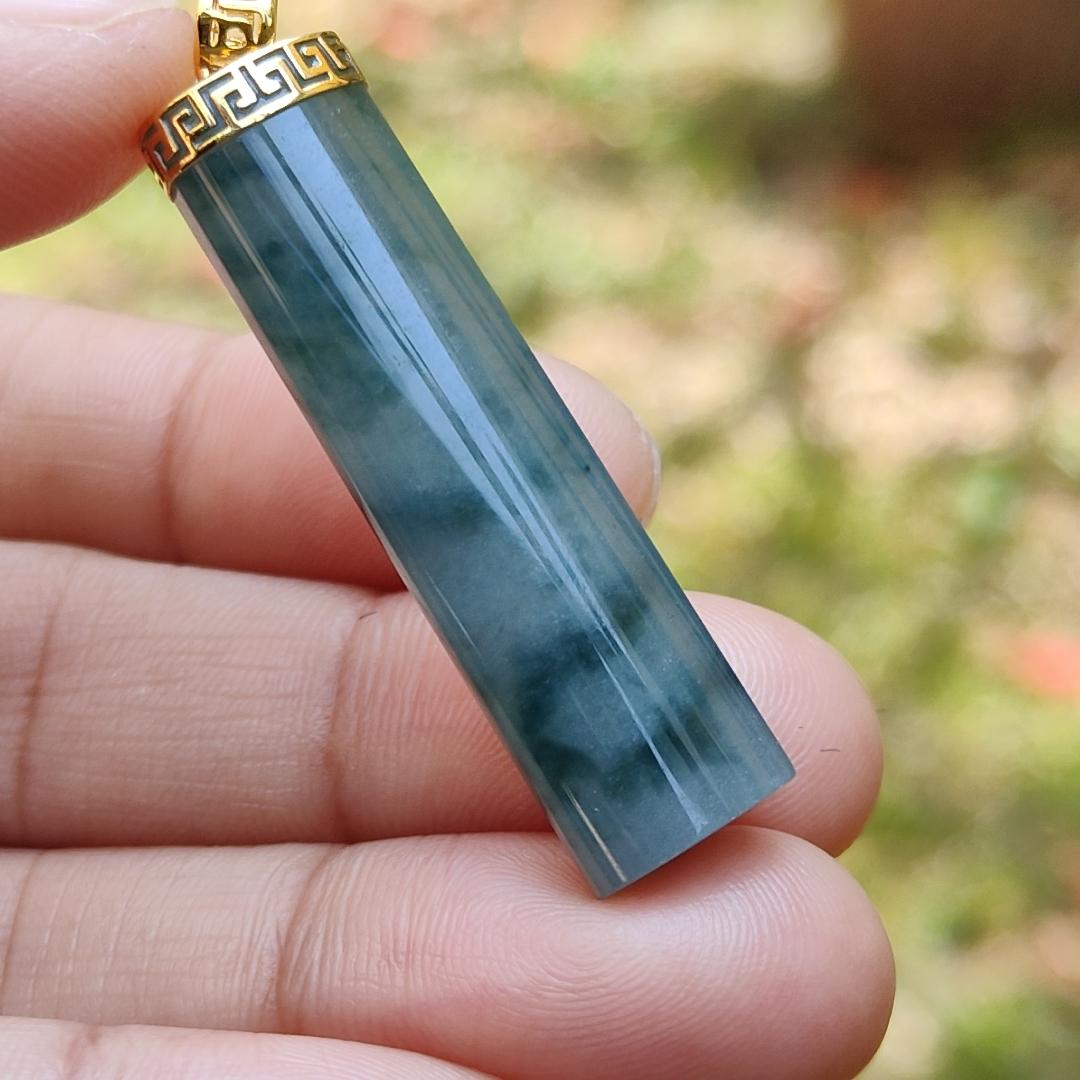 Dark Bluish Green Natural Type A Jadeite Jade crafter with a shape of Cylinder set with 18k gold clasp as Pendant, certificate included weigh 6.49 grams, measurement 37.6 * 9.6 * 6.3 mm (18kp28)