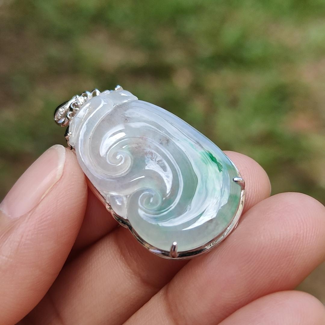 Icy Translucent with Light Green Patches Natural Type A Jadeite Jade crafted with shape of Ruyi set on 18k Gold as Pendant, certificate weighs 4.01 grams, measurement 37.6 * 18 * 5.5 mm (18kp51)