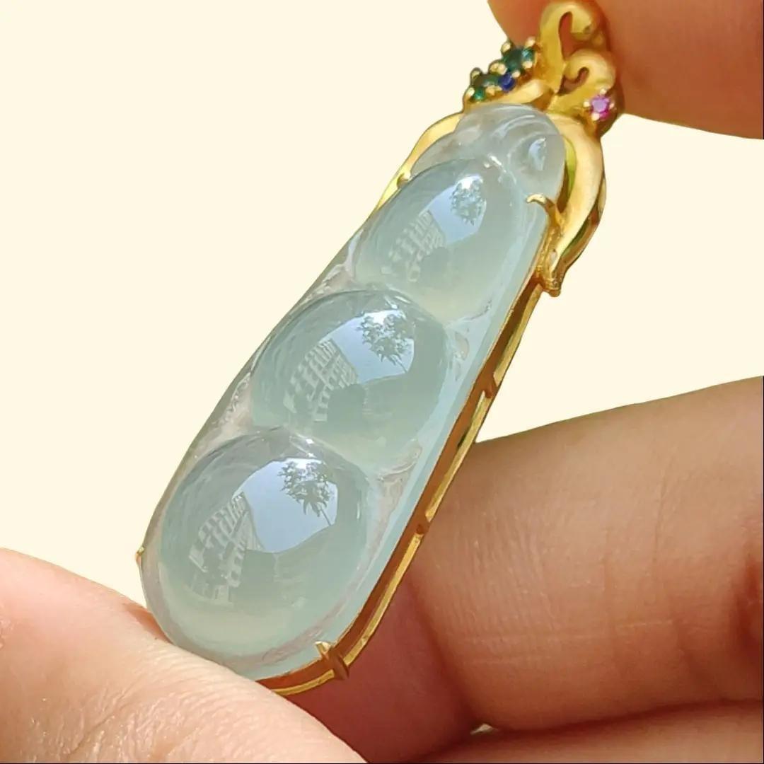 Icy Translucent Premium Quality Natural Type A Jadeite Jade crafted as Bean set on 18k Gold as Pendant, certificate weighs 5.31 grams, measurement 40.6 * 12 * 8 mm (18kp52)