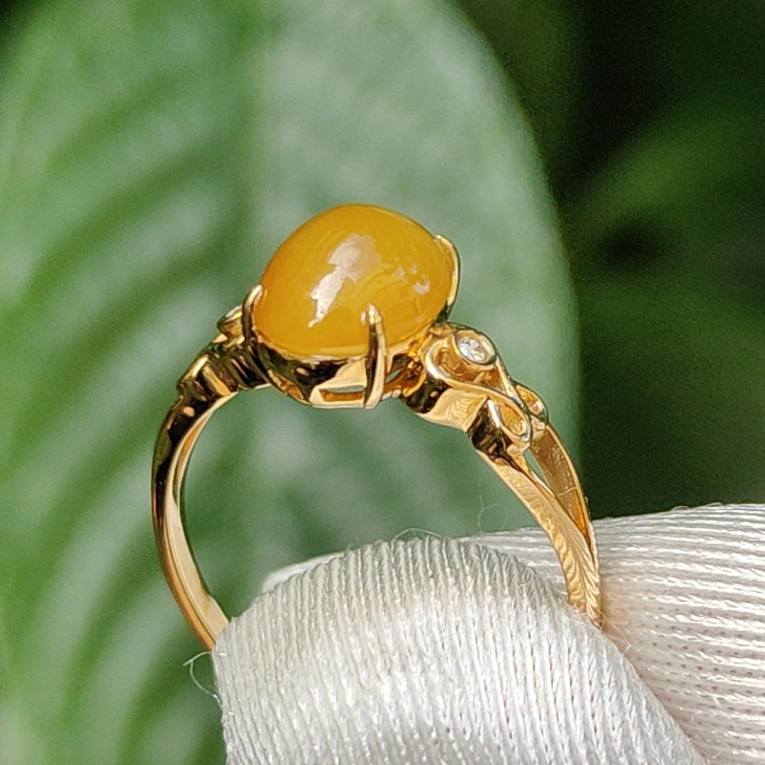 Yellow with a bit reddish Natural Type A Jadeite Jade Cabochon 8.6 * 7 * 3.6 mm set on 18k Gold as Ring adding 2 diamonds with certificate weigh 2.08 grams, finger size 16.8 mm (18kring13)