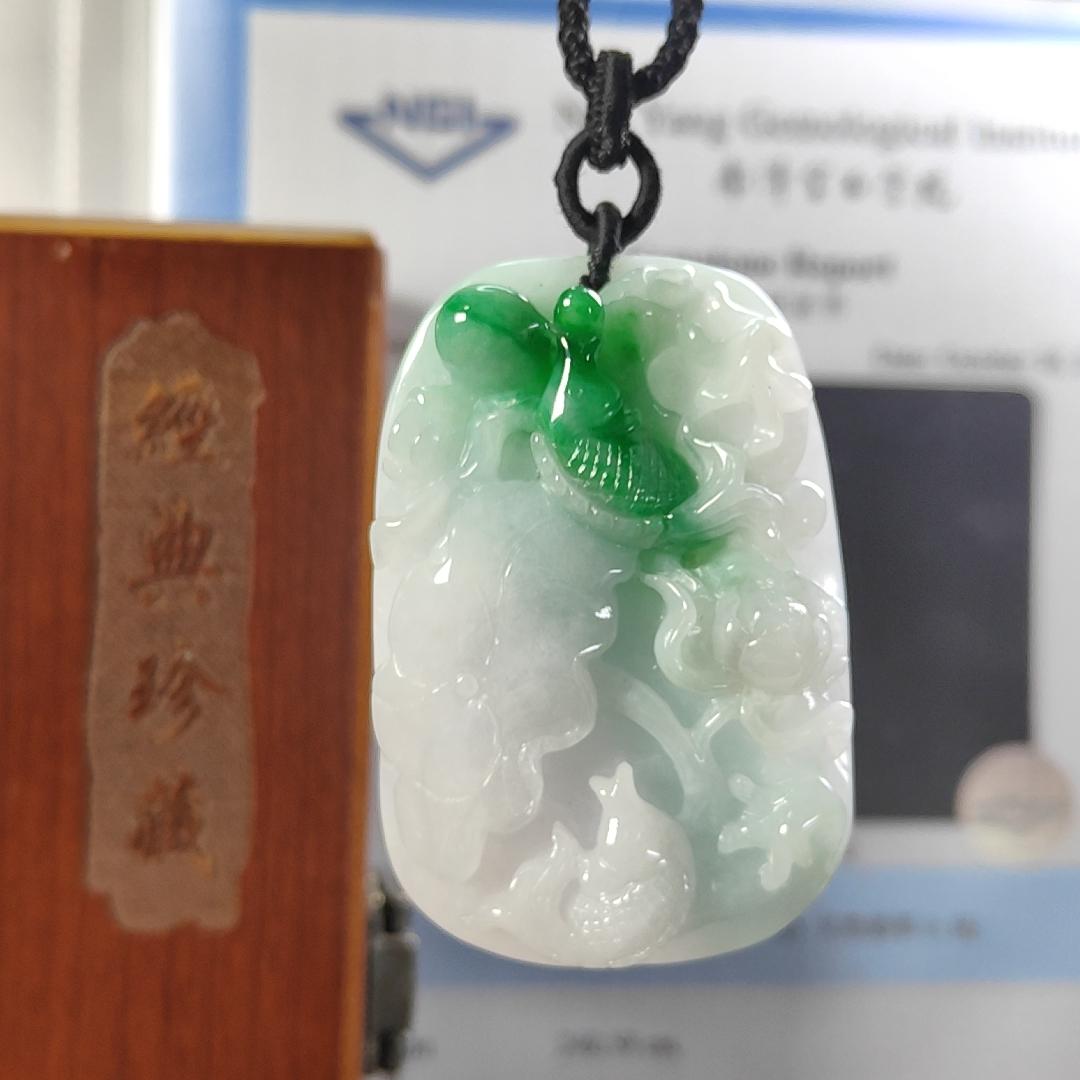 Carved with lotus fish Natural Type A Jadeite Pendant with Gemstone report from NGI - Weight 240.59 grams Measurement: 54.17 * 36.35 * 13.36 mm - Translucent with the Specify Gravity at 3.33 , Near white to faint green with green patches (pendant145)