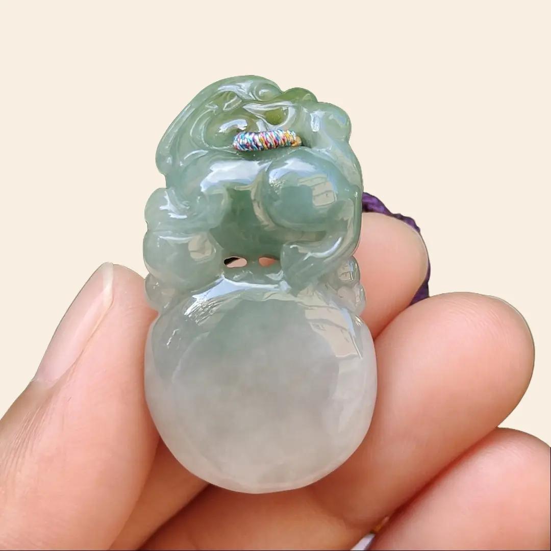 Light Green Natural Type A Jadeite Jade crafted with Lion as Pendant certificate weighs 14.94 grams, measurement 36.6 * 20.5 * 10.8 mm (pendant249)