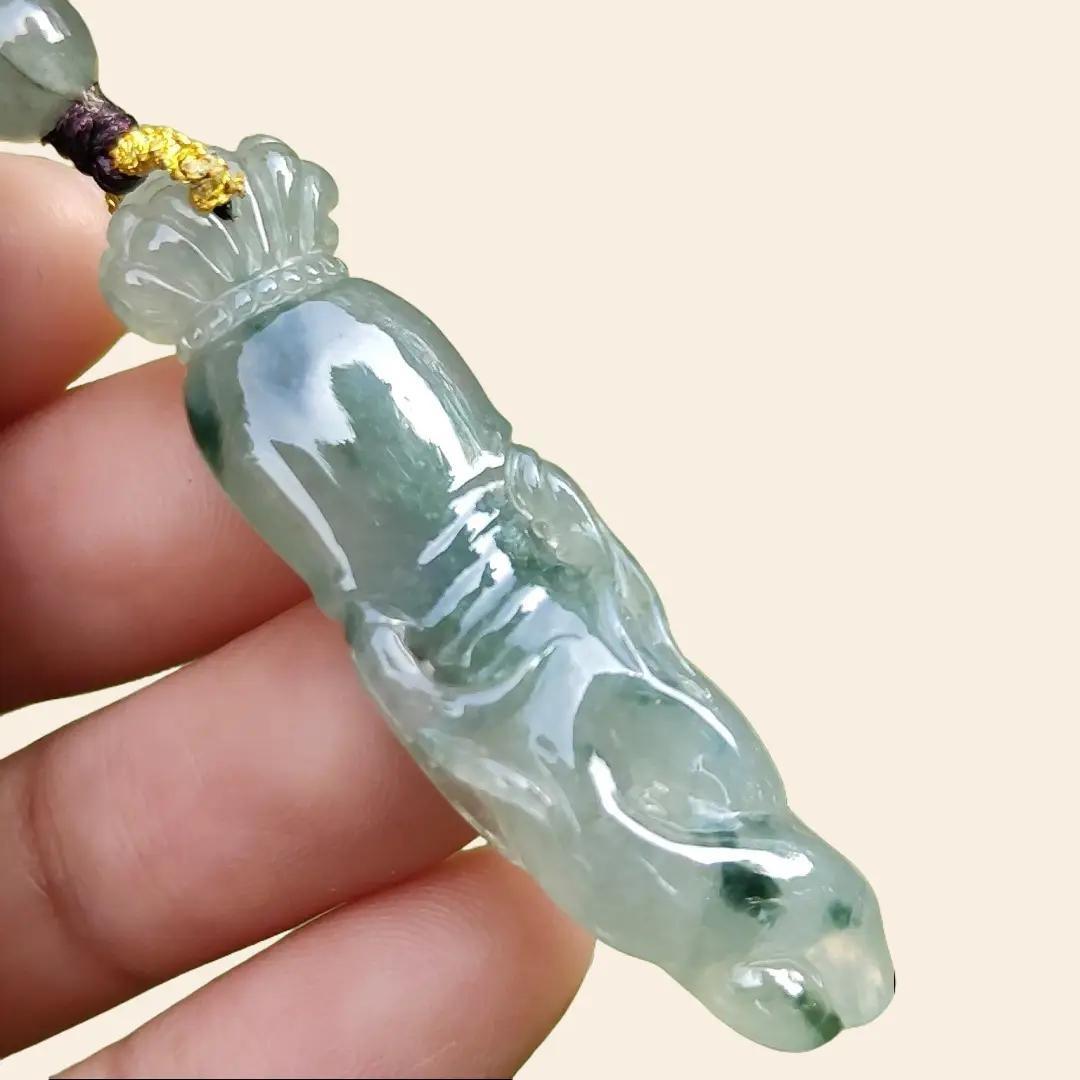 High Quality Light Green with Green Natural Type A Jadeite Jade crafted with shape of Ginseng as Pendant, certificate weighs 7.63 grams, measurement 48.2 * 12.7 * 7.1 mm (pendant277)