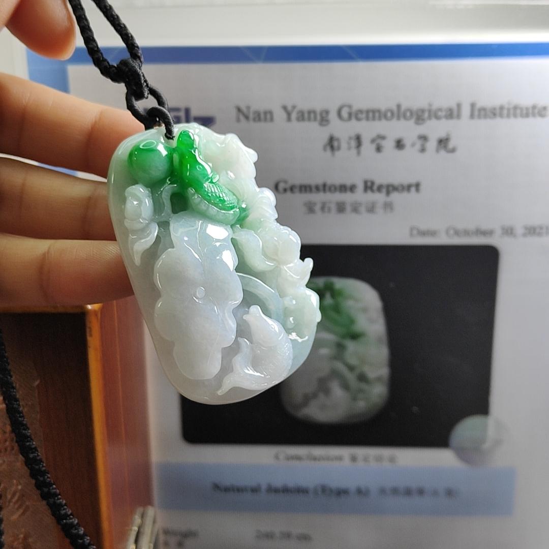 Carved with lotus fish Natural Type A Jadeite Pendant with Gemstone report from NGI - Weight 240.59 grams Measurement: 54.17 * 36.35 * 13.36 mm - Translucent with the Specify Gravity at 3.33 , Near white to faint green with green patches (pendant145)