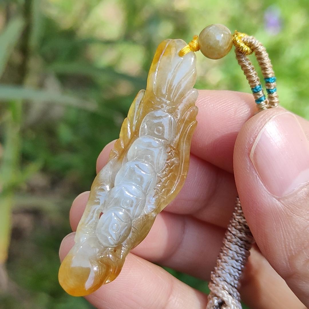 Yellow Natural Type A Jadeite crafted with Eagle and Chinese Coins symbols of Winner, Money and Luck, with GIC labs Approved certificate weigh 8.21 grams, 49.8 * 15.5 * 8.1 mm, very suitable for daily wear