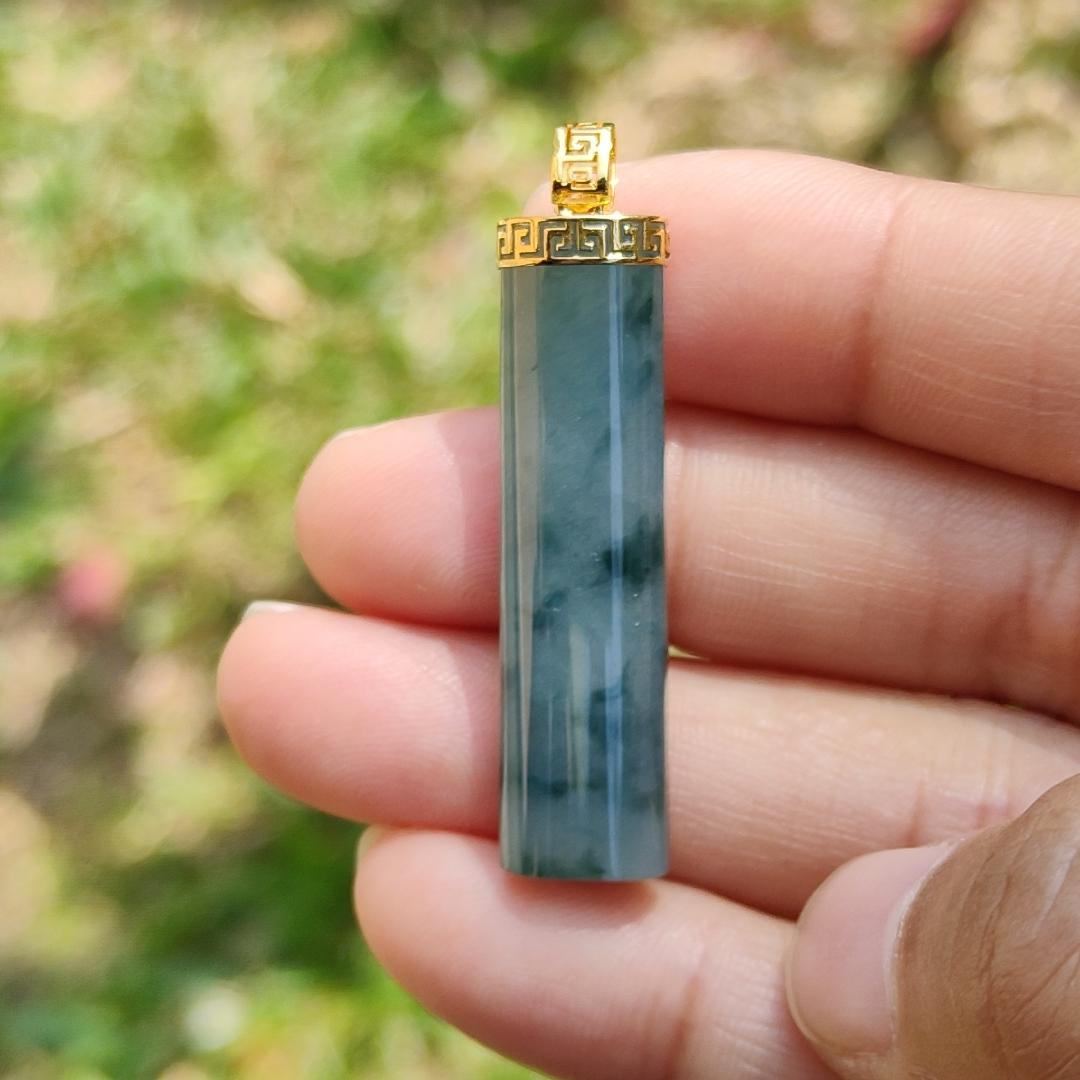 Dark Bluish Green Natural Type A Jadeite Jade crafter with a shape of Cylinder set with 18k gold clasp as Pendant, certificate included weigh 6.49 grams, measurement 37.6 * 9.6 * 6.3 mm (18kp28)