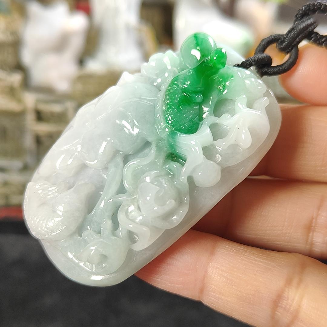 Carved with lotus fish Natural Type A Jadeite Pendant with Gemstone report from NGI - Weight 240.59 grams Measurement: 54.17 * 36.35 * 13.36 mm - Translucent with the Specify Gravity at 3.33 , Near white to faint green with green patches (pendant145)