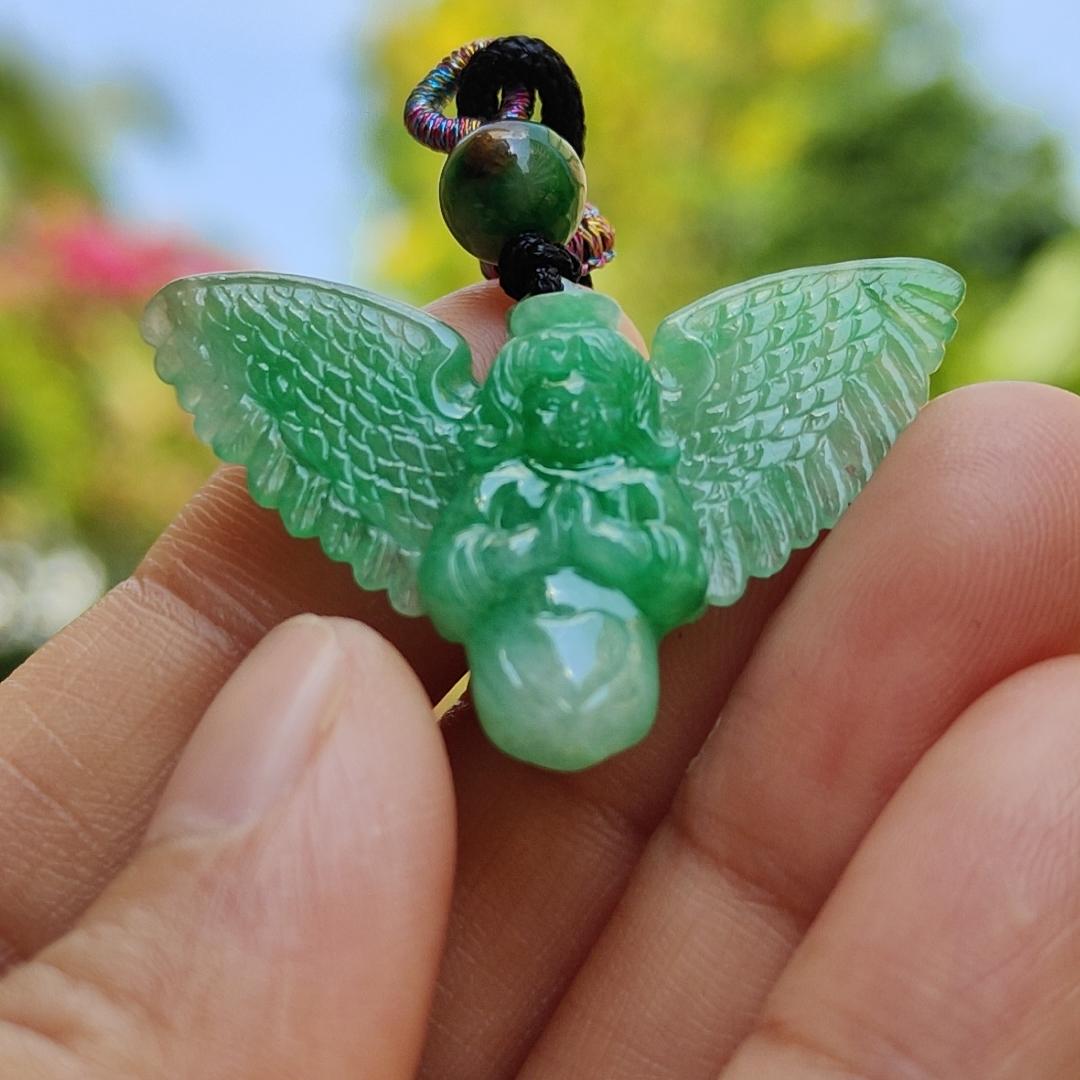 Green Jadeite carved as Angel (Front) and Cross (back) Natural Type A Jadeite pendant with NGI Gemstone report weight 6.33 gram , 35.39 * 23.76 * 5.61 mm with Translucent fine grain crystal aggregate granular and fibrous interlocking texture (pendant139)