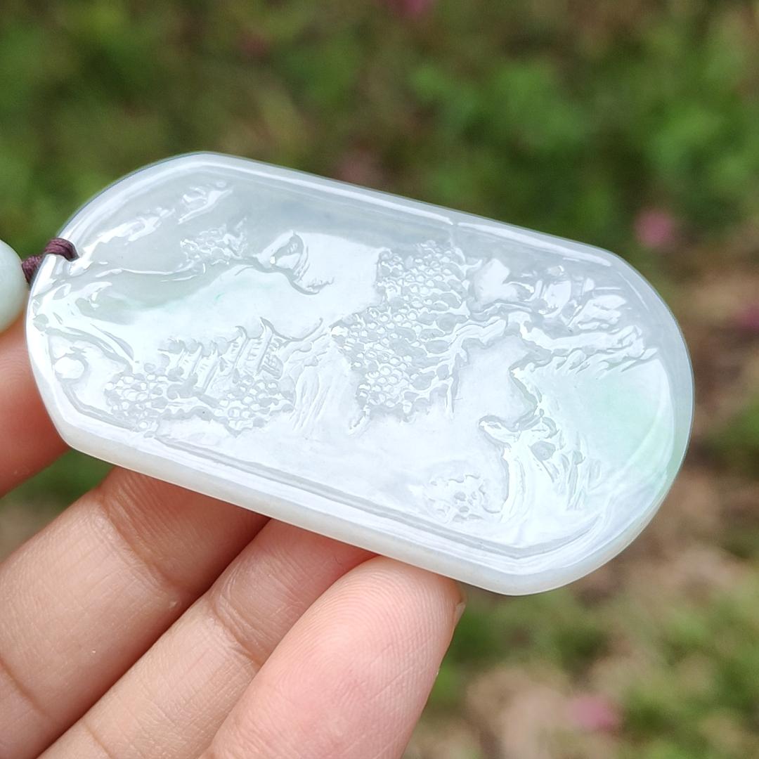 Quality Semi Icy White and Light Green Patches Natural Type A Jadeite Jade crafted with sceneries as pendant with QIC labs approved certificate weigh 24.89 grams, measurement 54 * 32 * 4.5 mm (pendant227)