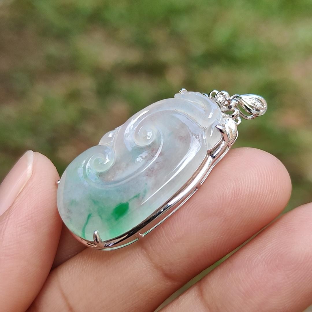 Icy Translucent with Light Green Patches Natural Type A Jadeite Jade crafted with shape of Ruyi set on 18k Gold as Pendant, certificate weighs 4.01 grams, measurement 37.6 * 18 * 5.5 mm (18kp51)