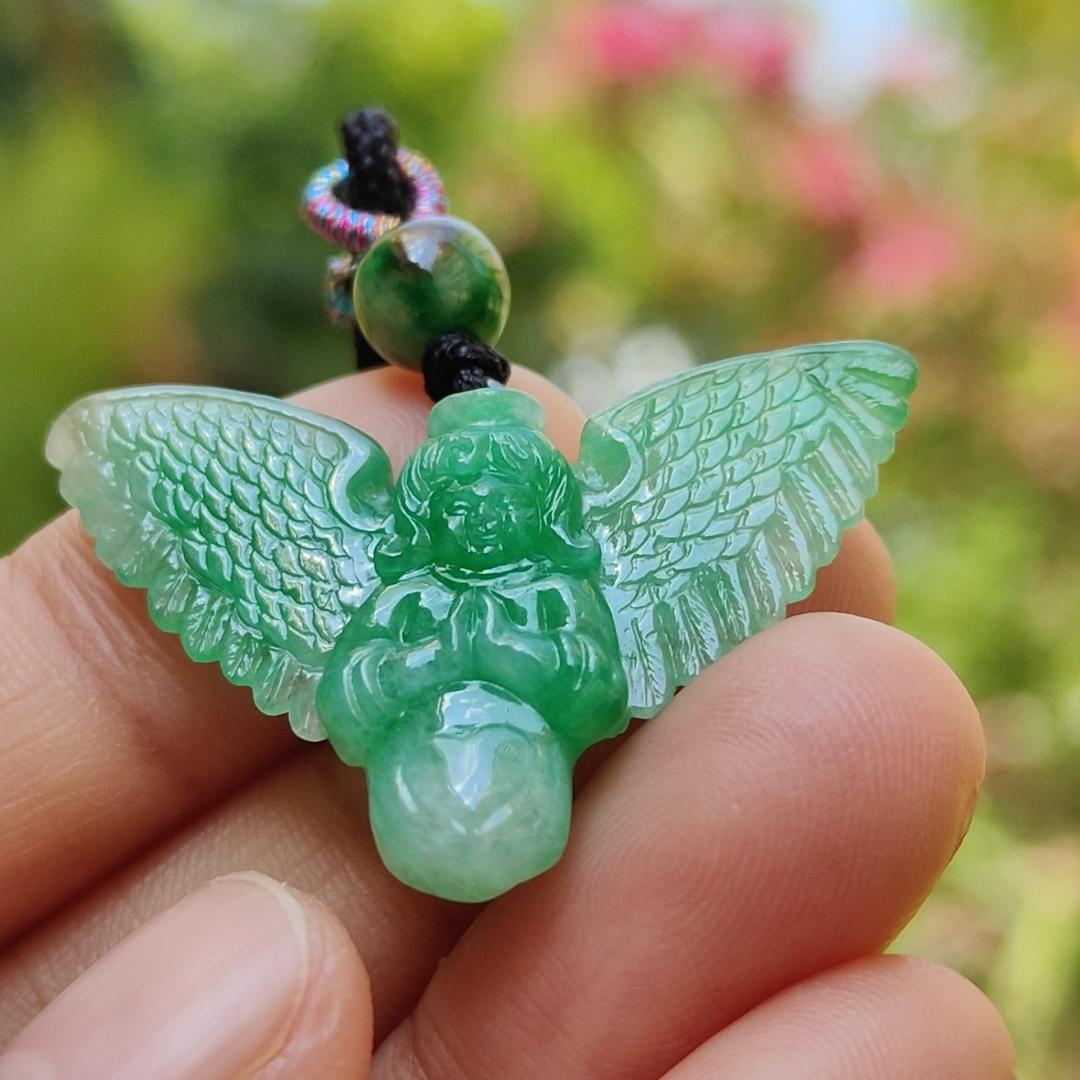 Green Jadeite carved as Angel (Front) and Cross (back) Natural Type A Jadeite pendant with NGI Gemstone report weight 6.33 gram , 35.39 * 23.76 * 5.61 mm with Translucent fine grain crystal aggregate granular and fibrous interlocking texture (pendant139)