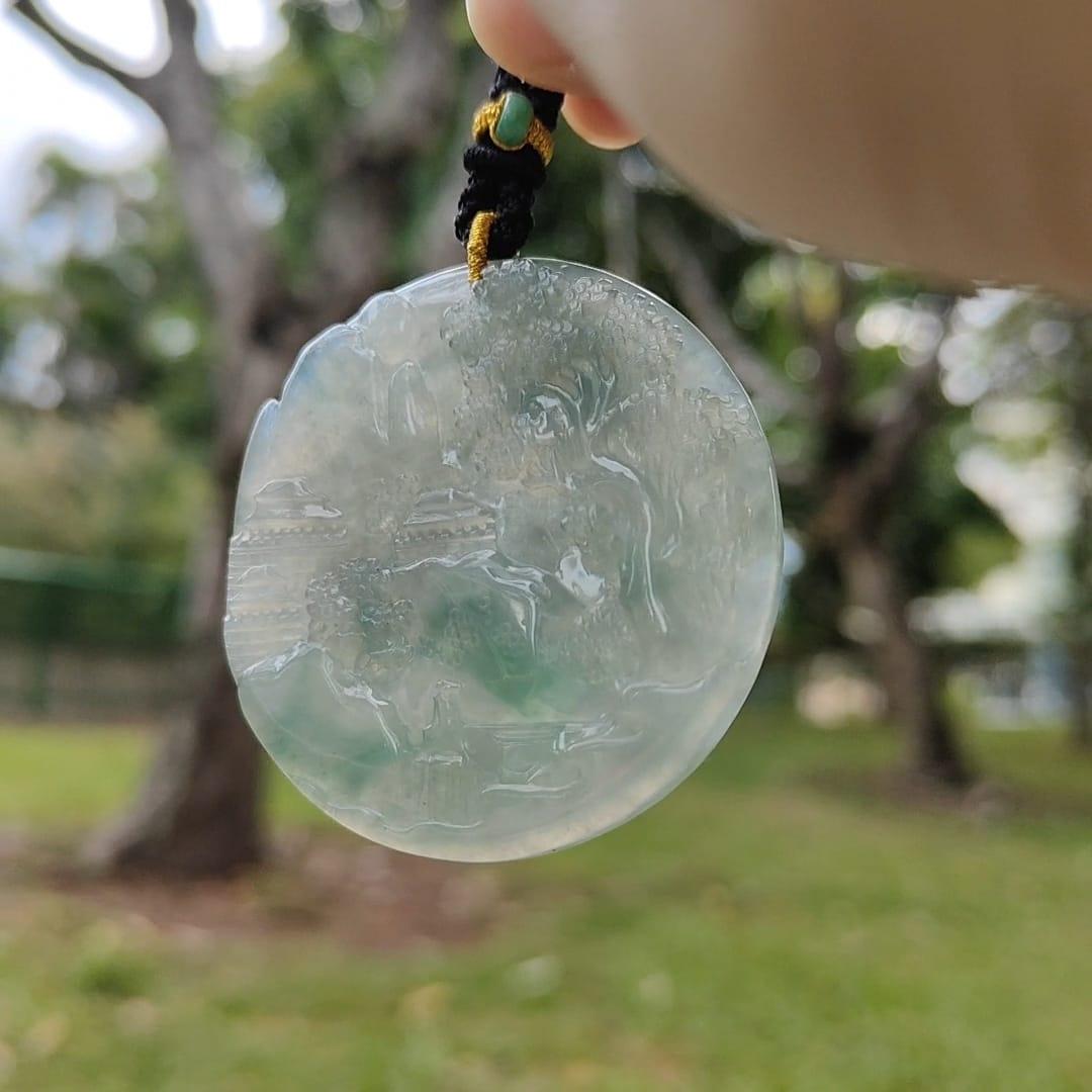 Natural Type A Jadeite carved with beautiful scenery - [51.08 * 51.11 * 6.31 mm] - Weight = 173.9 grams , premium pendant - Highly Translucent , faint greenish blue and green , NGI Certification (pendant155)