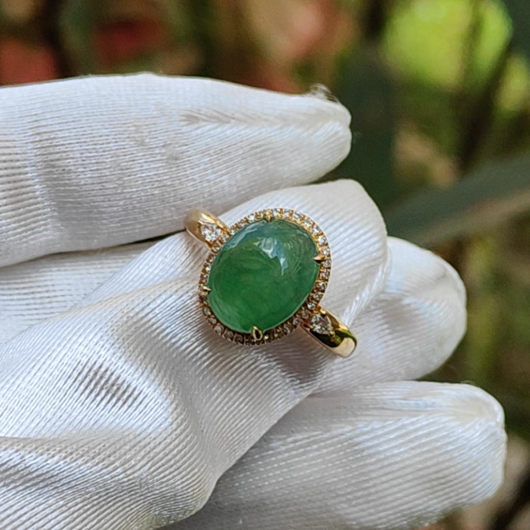 18K Gold weigh 2 grams, Setting with Natural Type A Jadeite Green Cabochon size 10.7 * 8.3 * 3.8 mm with 35 * 0.003 and 2 * 0.03 pear cut diamonds, certificate included weigh 2.65 grams, Finger ring size 17.3 mm,