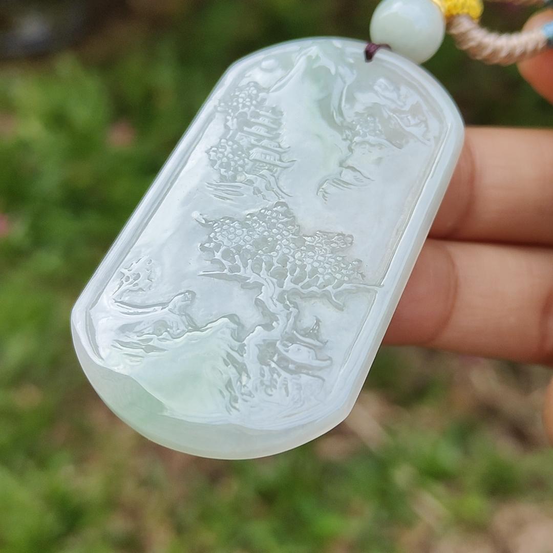 Quality Semi Icy White and Light Green Patches Natural Type A Jadeite Jade crafted with sceneries as pendant with QIC labs approved certificate weigh 24.89 grams, measurement 54 * 32 * 4.5 mm (pendant227)