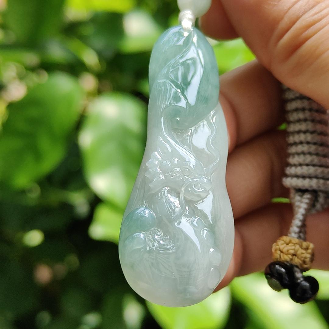 Good Quality Beautiful Natural Type A Jadeite Jade Light Green with Green Hue crafted with Dragon as Pendant, QIC labs approved certificated weigh 15.74 grams, measurements 56 * 20.5 * 6.2 mm (pendant296)