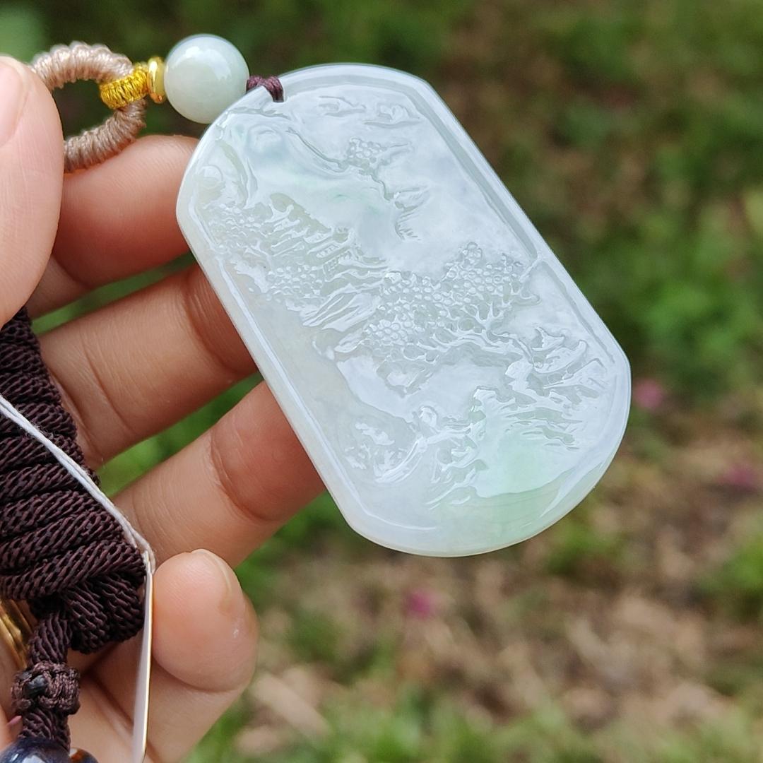 Quality Semi Icy White and Light Green Patches Natural Type A Jadeite Jade crafted with sceneries as pendant with QIC labs approved certificate weigh 24.89 grams, measurement 54 * 32 * 4.5 mm (pendant227)