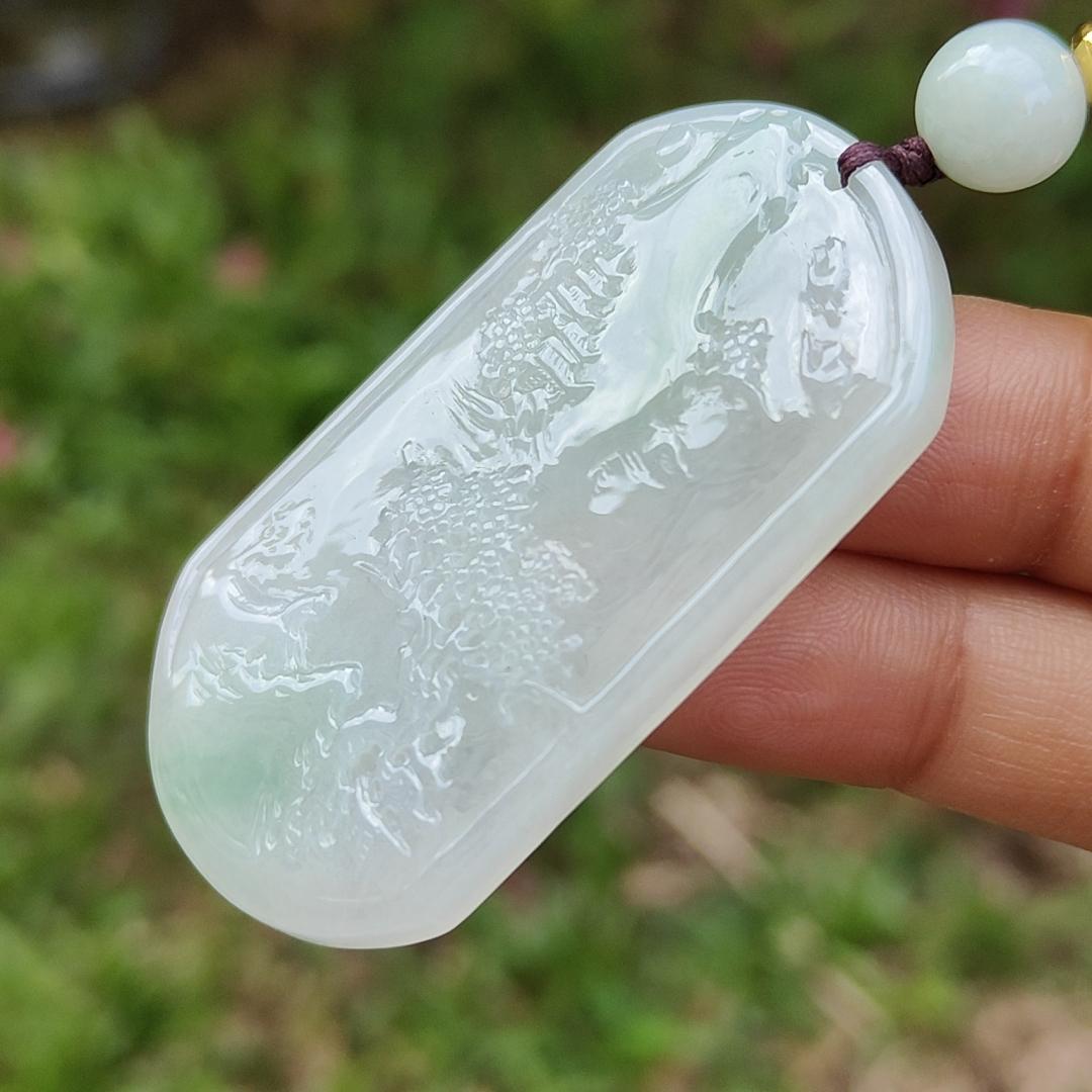 Quality Semi Icy White and Light Green Patches Natural Type A Jadeite Jade crafted with sceneries as pendant with QIC labs approved certificate weigh 24.89 grams, measurement 54 * 32 * 4.5 mm (pendant227)