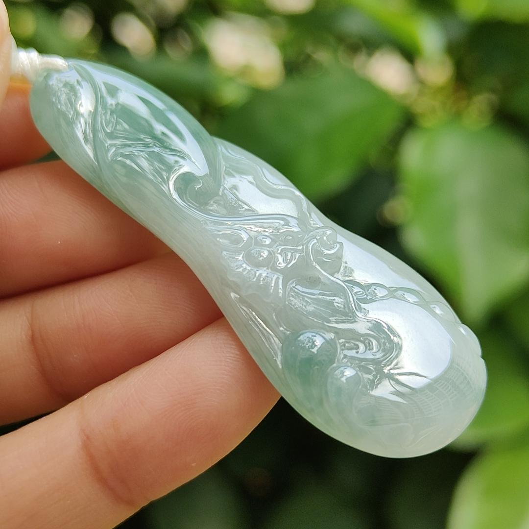 Good Quality Beautiful Natural Type A Jadeite Jade Light Green with Green Hue crafted with Dragon as Pendant, QIC labs approved certificated weigh 15.74 grams, measurements 56 * 20.5 * 6.2 mm (pendant296)