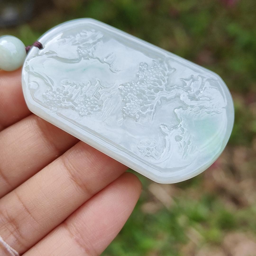 Quality Semi Icy White and Light Green Patches Natural Type A Jadeite Jade crafted with sceneries as pendant with QIC labs approved certificate weigh 24.89 grams, measurement 54 * 32 * 4.5 mm (pendant227)