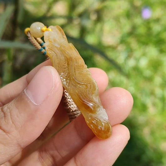 Yellow Natural Type A Jadeite crafted with Eagle and Chinese Coins symbols of Winner, Money and Luck, with GIC labs Approved certificate weigh 8.21 grams, 49.8 * 15.5 * 8.1 mm, very suitable for daily wear