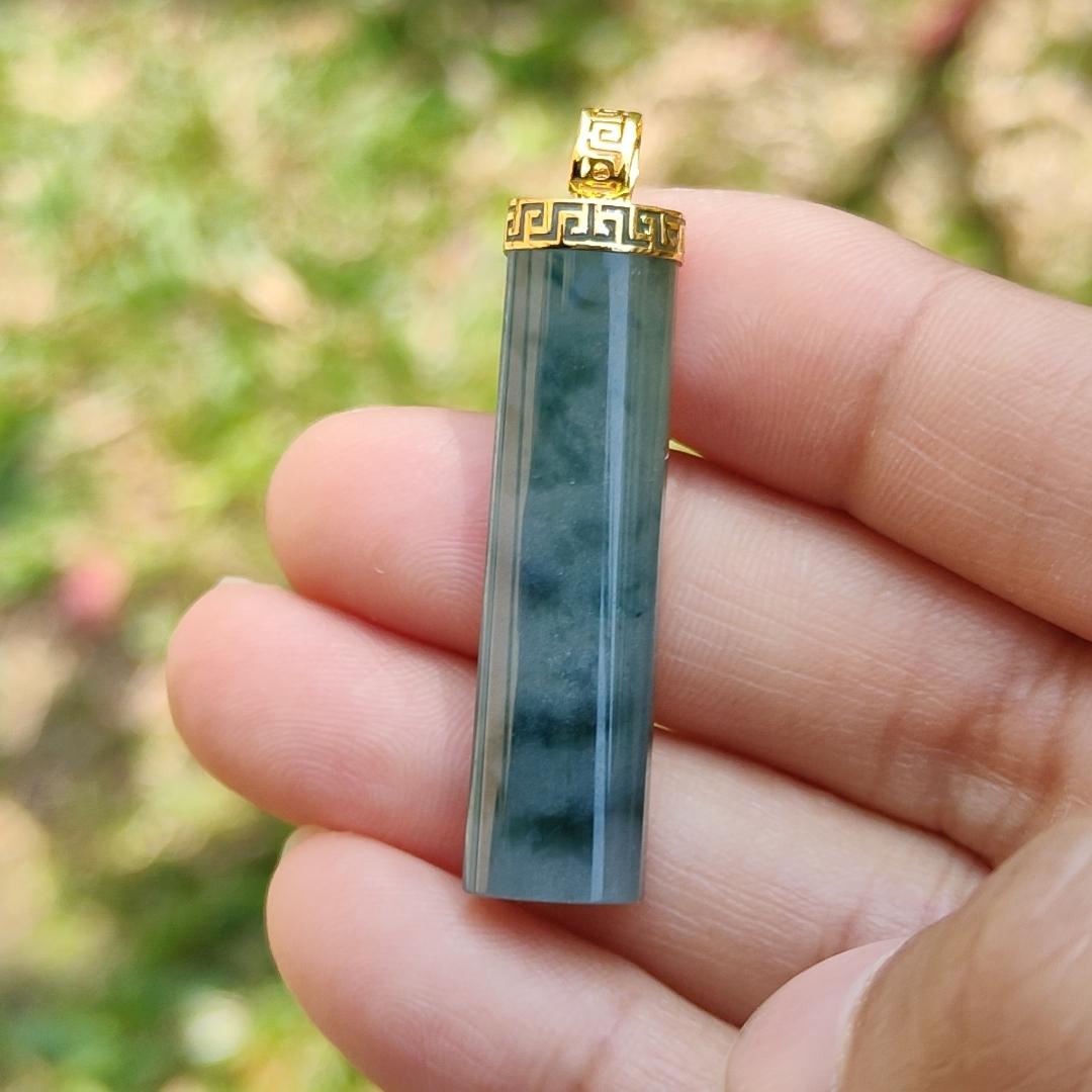 Dark Bluish Green Natural Type A Jadeite Jade crafter with a shape of Cylinder set with 18k gold clasp as Pendant, certificate included weigh 6.49 grams, measurement 37.6 * 9.6 * 6.3 mm (18kp28)