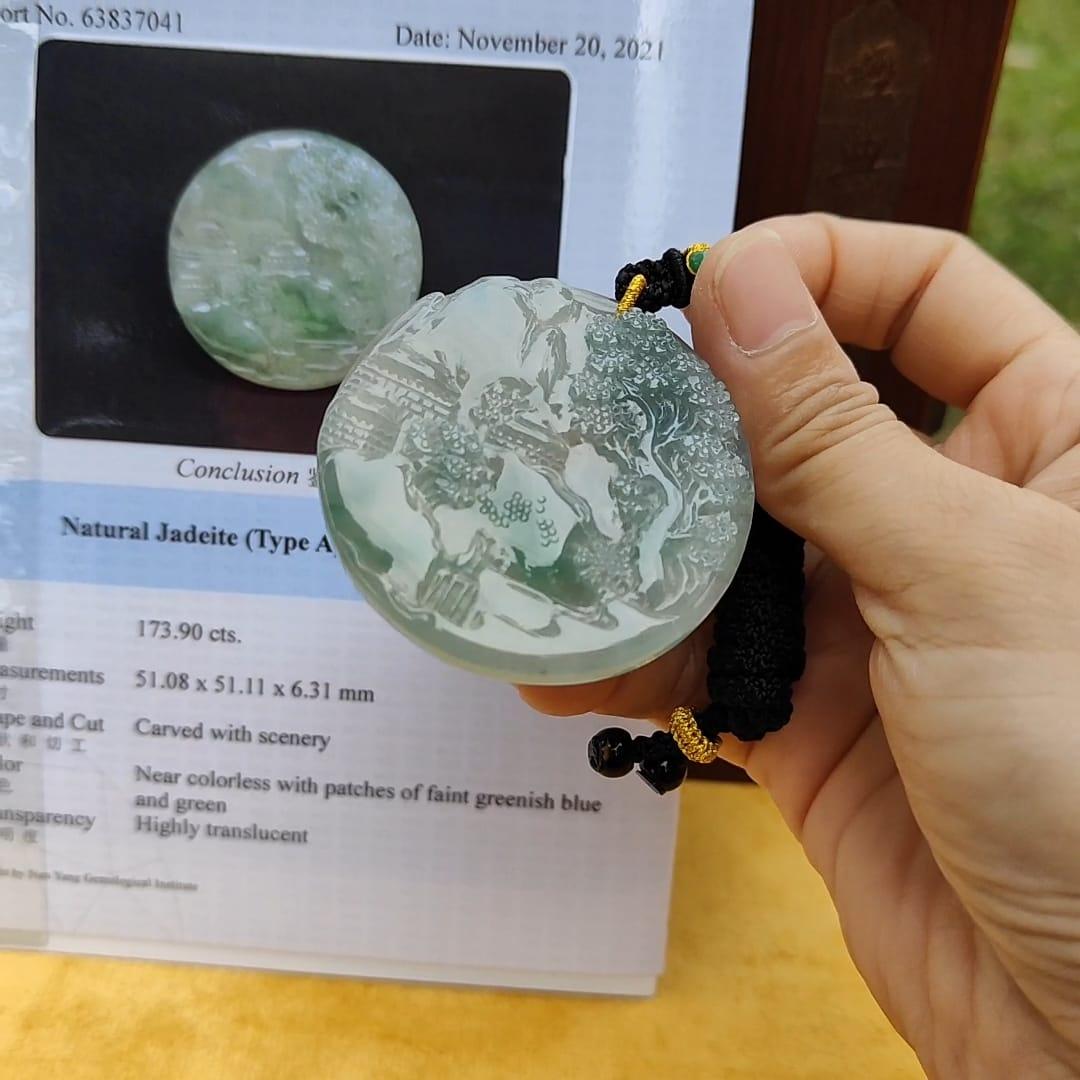 Natural Type A Jadeite carved with beautiful scenery - [51.08 * 51.11 * 6.31 mm] - Weight = 173.9 grams , premium pendant - Highly Translucent , faint greenish blue and green , NGI Certification (pendant155)