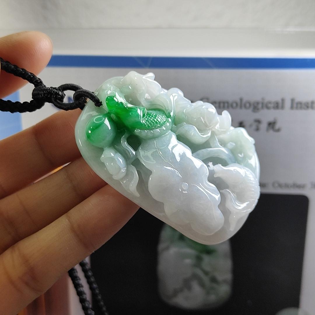 Carved with lotus fish Natural Type A Jadeite Pendant with Gemstone report from NGI - Weight 240.59 grams Measurement: 54.17 * 36.35 * 13.36 mm - Translucent with the Specify Gravity at 3.33 , Near white to faint green with green patches (pendant145)