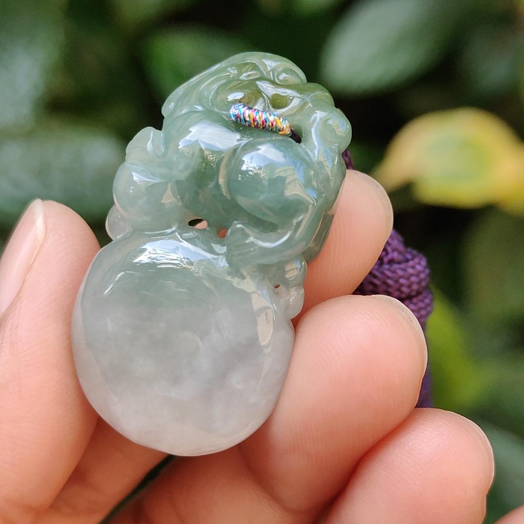 Light Green Natural Type A Jadeite Jade crafted with Lion as Pendant certificate weighs 14.94 grams, measurement 36.6 * 20.5 * 10.8 mm (pendant249)