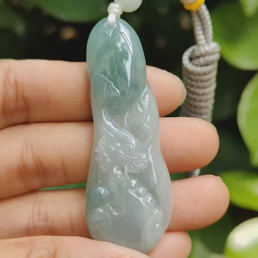 Good Quality Beautiful Natural Type A Jadeite Jade Light Green with Green Hue crafted with Dragon as Pendant, QIC labs approved certificated weigh 15.74 grams, measurements 56 * 20.5 * 6.2 mm (pendant296)