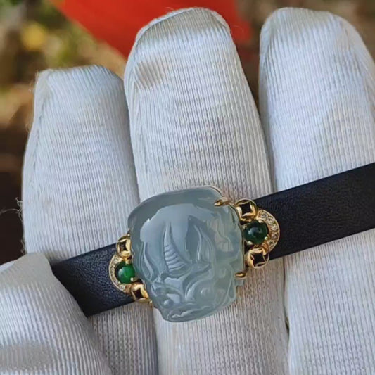 Light Green Hue Natural Type A Jadeite Jade crafted as Pixiu set on 18k Gold with 2 Green Cabochon and diamonds, adding PU wrist band upgraded elegant style bracelet, certificate weigh 4.44 grams, measurement 16.6 * 14.1 * 7.5 mm (18kpw1)